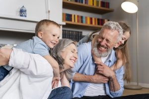 Grandparents laugh with their grandchildren, enjoying the security of HealthShare membership